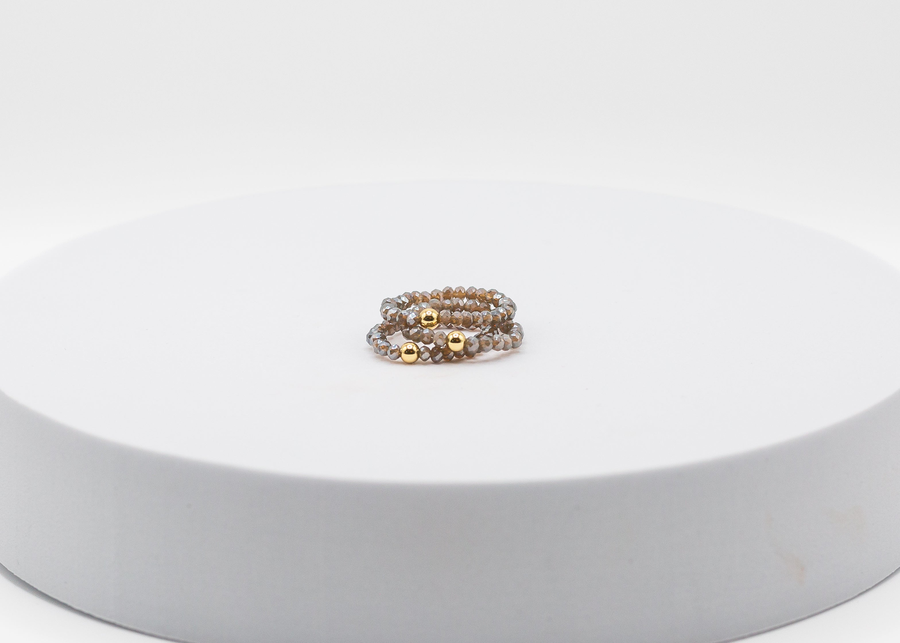 Crystal Stretch Ring with Gold Center Bead (Taupe)
